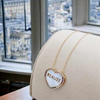 Imagem de Colar coração madrepérola "realize" banhado a ouro