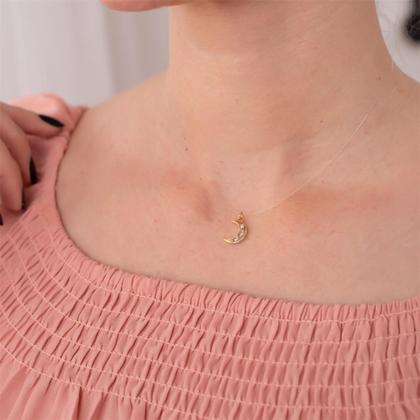 Imagem de Gargantilha Fio De Nylon Meia Lua Com Pontos De Luz Folheado