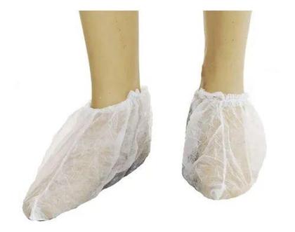 Imagem de Kit 100 Protetor De Pé Propé Sapatilha Descartável + 100 Touca Descartável em TNT sanfonada. - Nobre