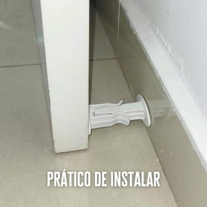 Imagem de Kit 2 Un Trava Porta Prendedor Fixador Adesivo Parede Rodapé