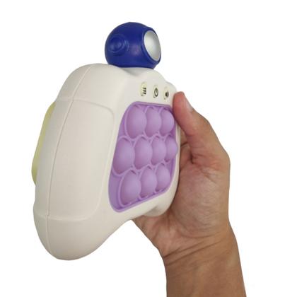 Imagem de Pop It Mini Game Fidget Sensorial 4 Modos Astronauta Luz Som Portatil Criança Jogo Ansiedade