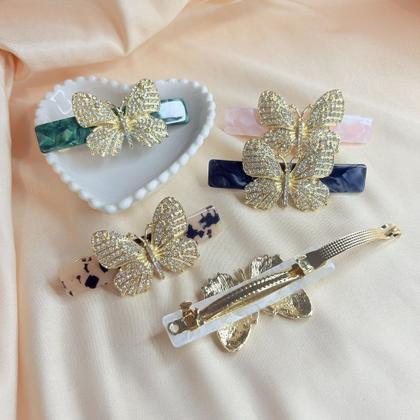 Imagem de Presilha de Cabelo Mesclada com Borboleta Dourada e Pedras de Strass