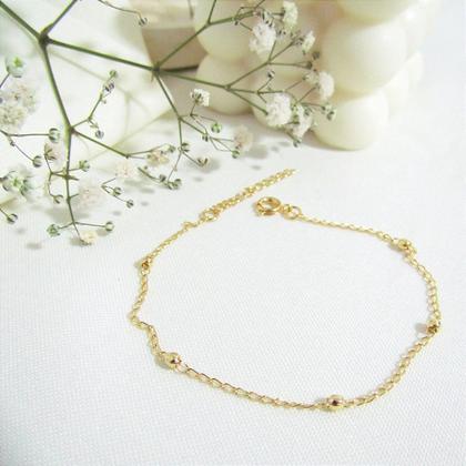 Imagem de Pulseira Feminina de Corrente Gourmet com 5 Bolinhas Pequenas - Banhada a Ouro 18k