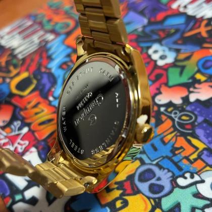 Imagem de Relógio masc analógico aço inox aro dourado calendario fundo azul Quartz