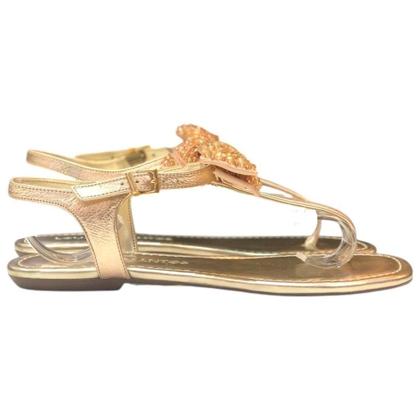 Imagem de Sandália rasteira laço dourada loucos e santos l10133013