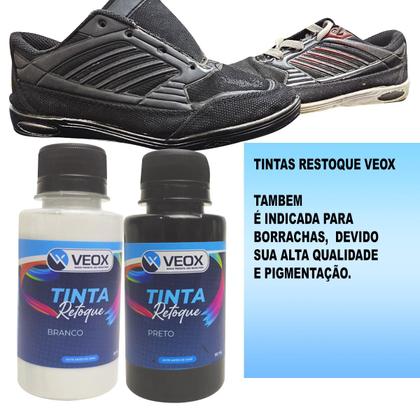 Imagem de tinta para solado preto e pincel de pintura veox retoque