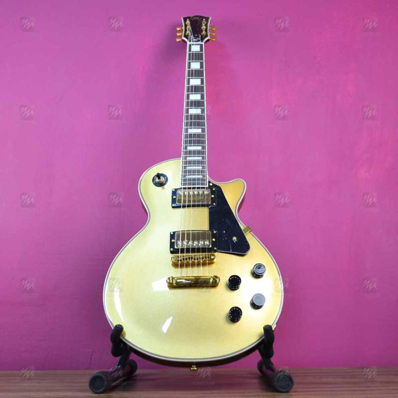 Guitarra Les Paul SX EH3 Dourada com Escudo Clássico Preto e
