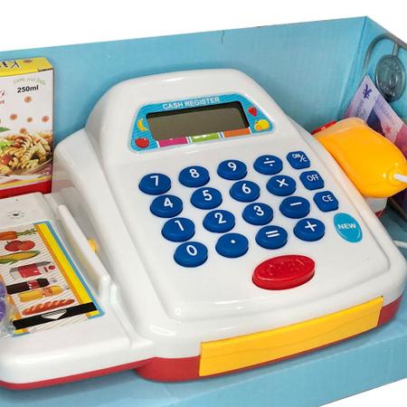 Legumes de brinquedo na cesta, caixa registradora com moedas, loja de jogos  infantis, conceito de compra de comida online, closeup