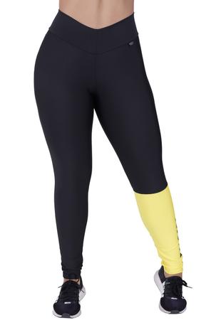 Calça legging technology preta com silk lateral amarelo ouro