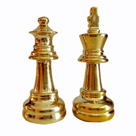 O conjunto de elemento de peças de xadrez dourado, rei, rainha