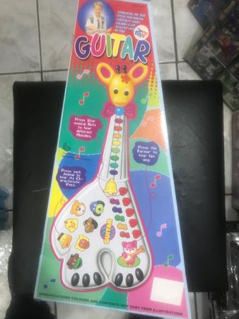 Imagem de Guitarra girafa com som de animais