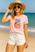 Camiseta rosa com short branco