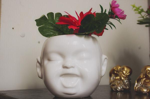 Imagem de cachepot rosto buda