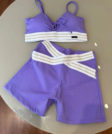 Imagem de Conjunto fitnnes na cor roxa com branco . Contém bojo removível TAM M