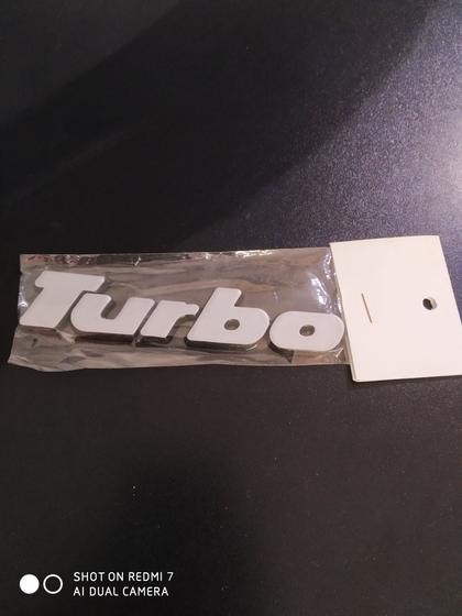 Imagem de Emblema turbo prata material acrílico  com dupla face fácil aplicação
