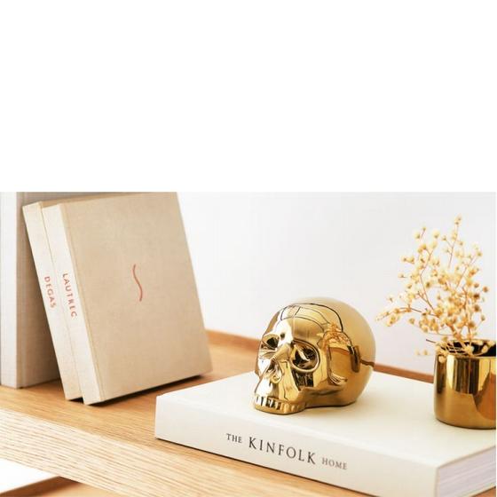 Imagem de Escultura cranio dourado em ceramica