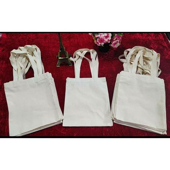 Imagem de Kit com 50 ecobags lisas 25x30cm - 100% algodão cru