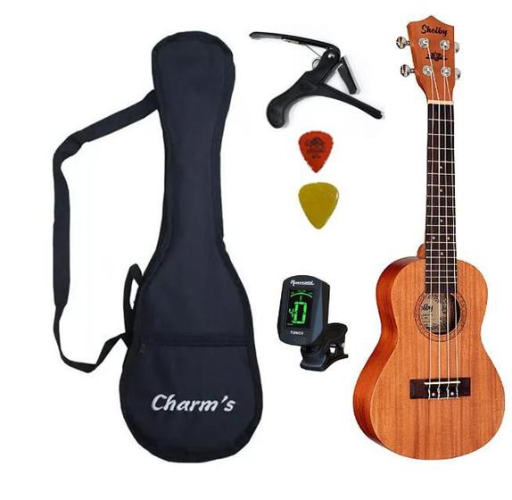 Imagem de Kit ukulele soprano acústico su21m shelby  +capa + capotraste  + afinador eletrônico + 2 palhetas