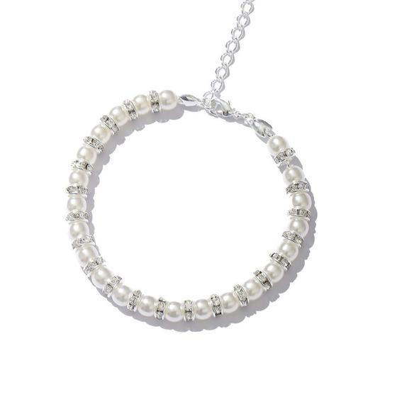 Imagem de Pulseira com perolas e aro de strass