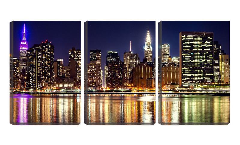 Imagem de Quadro canvas 55x110 torres e prédios iluminados