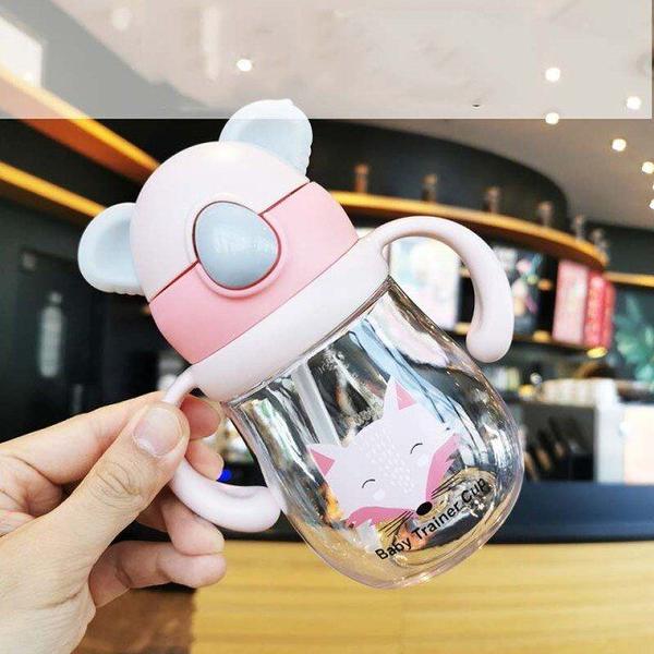 Imagem de 300ml baby learning drinking cup miracle trainer cup no spill trainer water cup with two handles for infant baby Copos (Rosa)