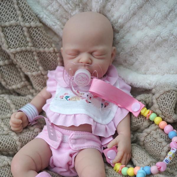 Imagem de Bebê Reborn Realista Brastoy Boneca Silicone Sólido 35cm Com Kit Conjunto de Roupa Chupeta Mamadeira e Pelúcia Pode Tomar Banho