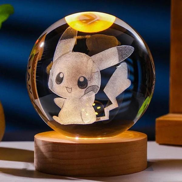 Imagem de Bola de Cristal 3D 6cm com Luz Noturna - Pikachu, Doraemon, Hello Kitty (Escolha seu Personagem)