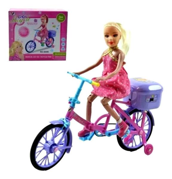 Imagem de Boneca na Bicicleta A Pilha Com Luz E Som Anda Sozinha.