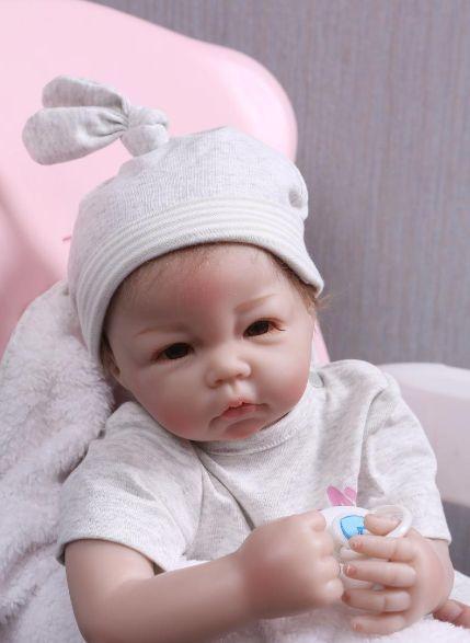 Imagem de Boneca Reborn Baby Doll Wokex 50 cm, vinil de silicone, olhos castanhos, menina