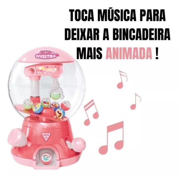 Brinquedo Mini Maquina Garra Divertida Pega Bolinha Dm Toys Imagem de Brinquedo Mini Maquina Garra Divertida Pega Bolinha Dm Toys