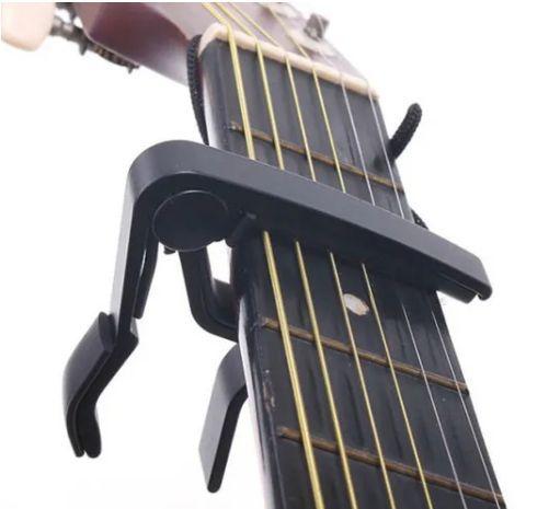 Capotraste /Braçadeira Violão, Guitarra - Preto Dolphin 6381 Imagem de Capotraste /Braçadeira Violão, Guitarra - Preto Dolphin 6381