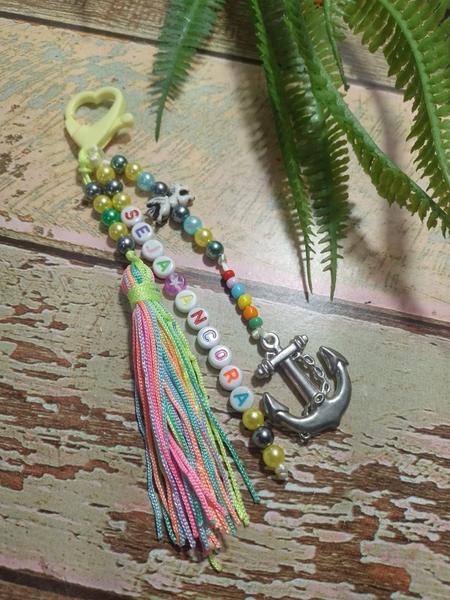Chaveiros motivacionais em pérolas com tassel - Ateliê DY Princesas Imagem de Chaveiros motivacionais em pérolas com tassel