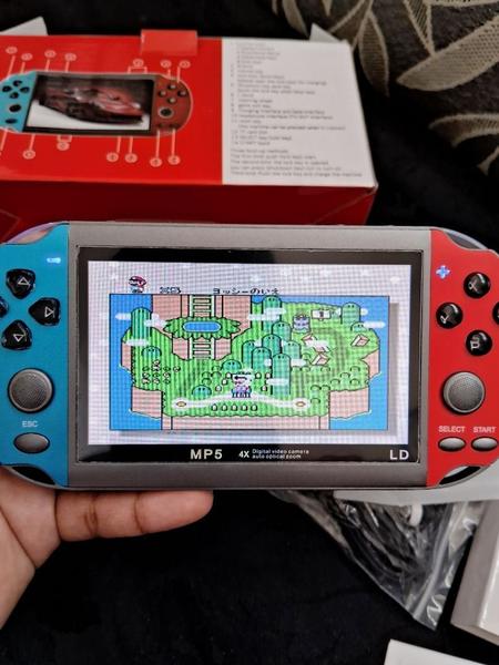 Console Portátil Retrô X7 com Tela de 5.1'' - Diversão Clássica em Suas Mãos Jogos Clássicos e Design Compacto! - Unity Imagem de Console Portátil Retrô X7 com Tela de 5.1'' - Diversão Clássica em Suas Mãos Jogos Clássicos e Design Compacto!