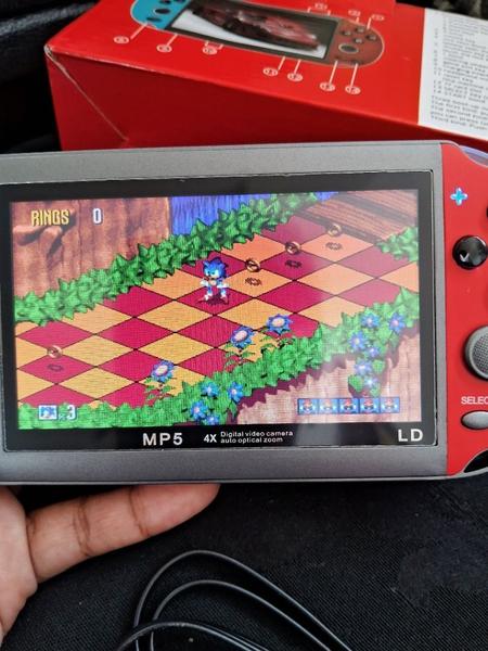 Console Portátil Retrô X7 com Tela de 5.1'' - Diversão Clássica em Suas Mãos Jogos Clássicos e Design Compacto! - Unity Imagem de Console Portátil Retrô X7 com Tela de 5.1'' - Diversão Clássica em Suas Mãos Jogos Clássicos e Design Compacto!
