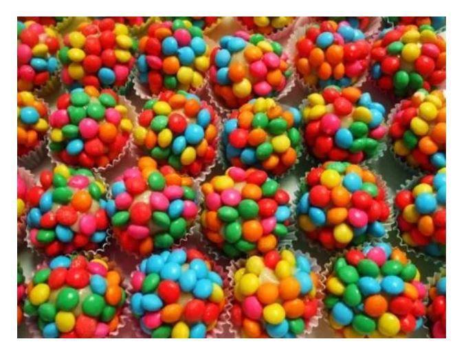 Disqueti De Chocolate Ao Leite Colorido A Granel 2kg - Dori Imagem de Disqueti De Chocolate Ao Leite Colorido A Granel 2kg