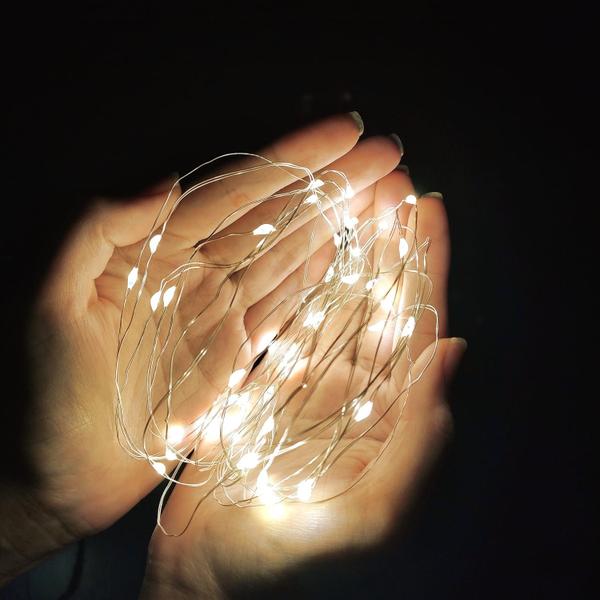 Fio de Fada 100Leds Bivolt Pisca Luz Branco Quente Natal 10m - Multiart Christmas Imagem de Fio de Fada 100Leds Bivolt Pisca Luz Branco Quente Natal 10m