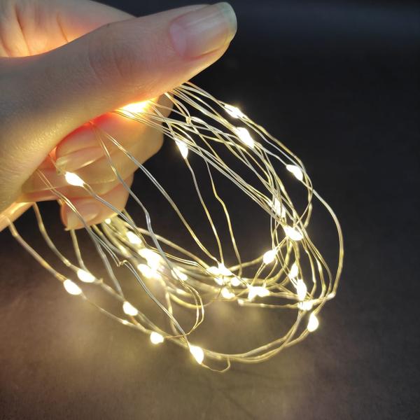 Fio de Fada 100Leds Bivolt Pisca Luz Branco Quente Natal 10m - Multiart Christmas Imagem de Fio de Fada 100Leds Bivolt Pisca Luz Branco Quente Natal 10m