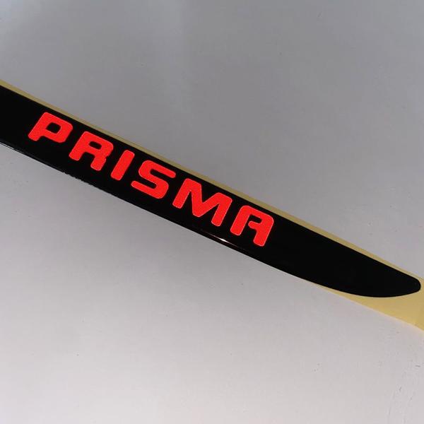 Imagem de Friso Traseiro Preto Prisma 2007 Até 2012 + Emblema Vermelho