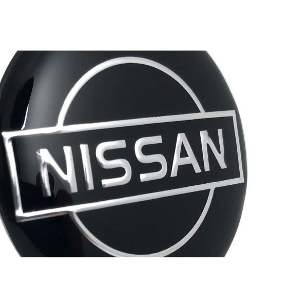 Imagem de Jogo 4 Emblema Roda  Nissan Preto 55mm.