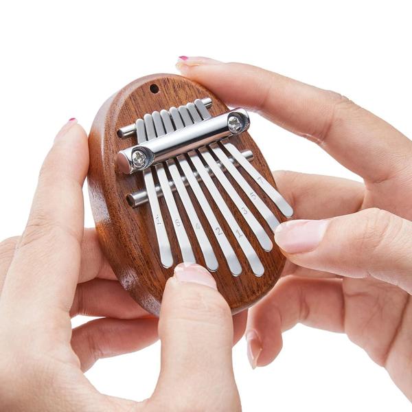 Imagem de Mini Kalimba 8 Teclas para Crianças - Estilo Gota d'Água - Portátil e Bonito