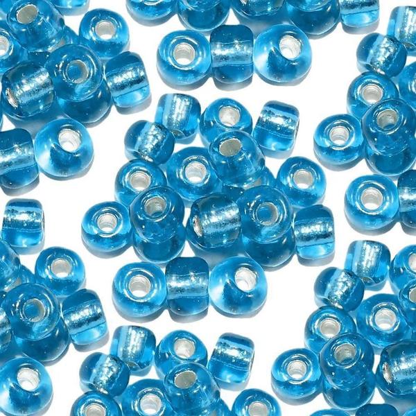 Imagem de Pacote com 50 gramas miçangão azul claro cristal