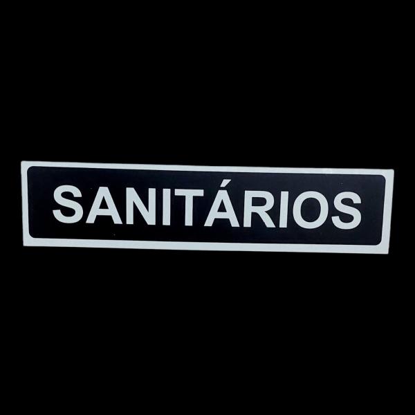 Imagem de Placa Sinalização 30x7 SANITARIOS fundo preto letra branca