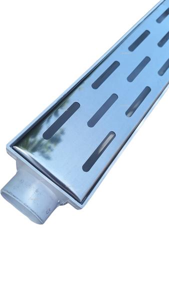 Ralo de Banheiro Linear 6x50 modelo Grelha Inox Polida Desenho Traçado Coletor Branco - Ficone Reis - Ficone & Reis Imagem de Ralo de Banheiro Linear 6x50 modelo Grelha Inox Polida Desenho Traçado Coletor Branco - Ficone Reis