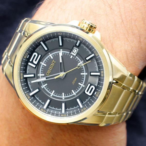 Imagem de Relogio orient masculino dourado fundo preto mgss1141 g2kx