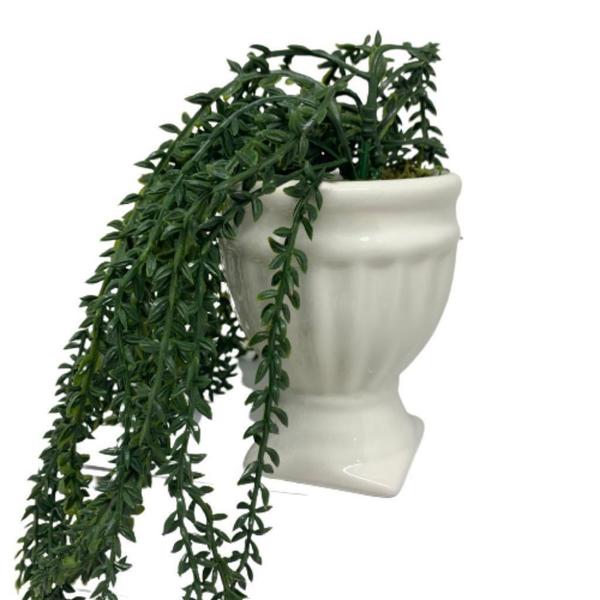 Imagem de Vaso com pedestal branco com planta caída