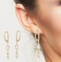 Imagem de Brinco Argola Oval com duas Zirconias pendentes Banhado a Ouro 18k
