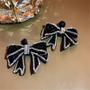 Imagem de Brincos Pendurados com Laço de Strass Preto - Estilo Coreano