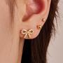 Imagem de Brincos Poxtex Gold Bow Studs banhados a ouro 14K para mulheres