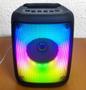 Imagem de Caixinha de Som Karaokê com Microfone FM Bluetooth Super LEDs
