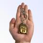 Imagem de Chaveiro Buda Rosto Dourado 12 Cm Resina E Metal